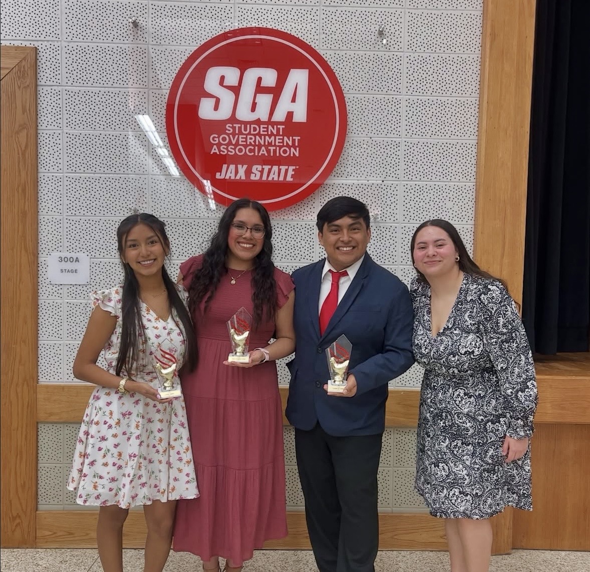 El Latido student leaders holding awards at Jax State